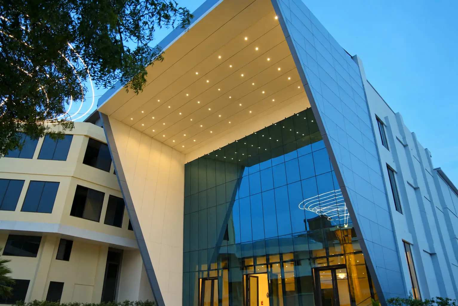The glass and stone entrance of the convention centre