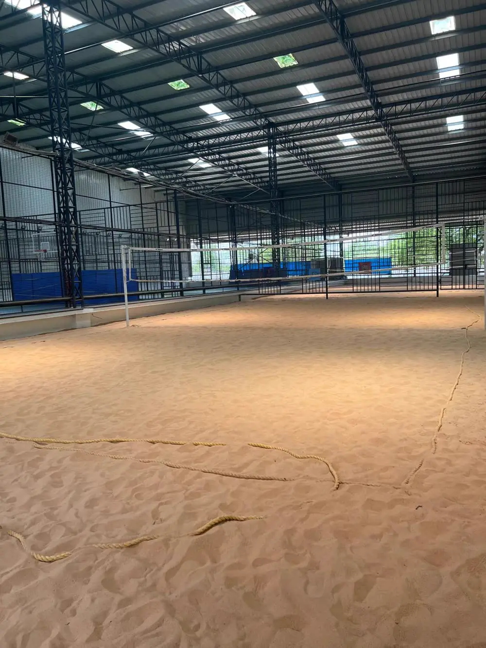 An indoor beach-volleyball sand court