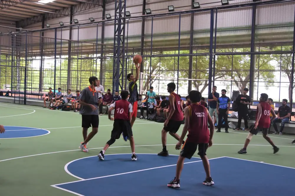 A basketball match on the indoor court