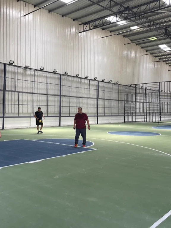 An indoor basketball court in play
