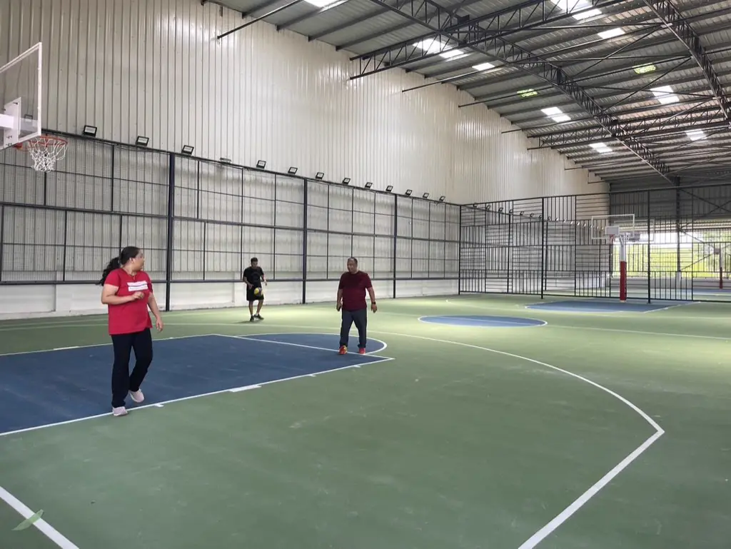 An indoor basketball court in play