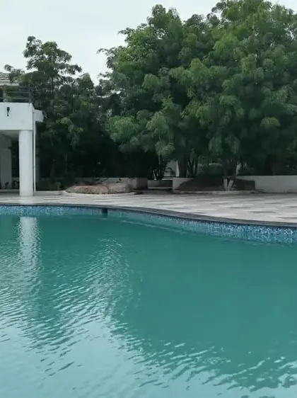 The outdoor pool and its pavilion by day