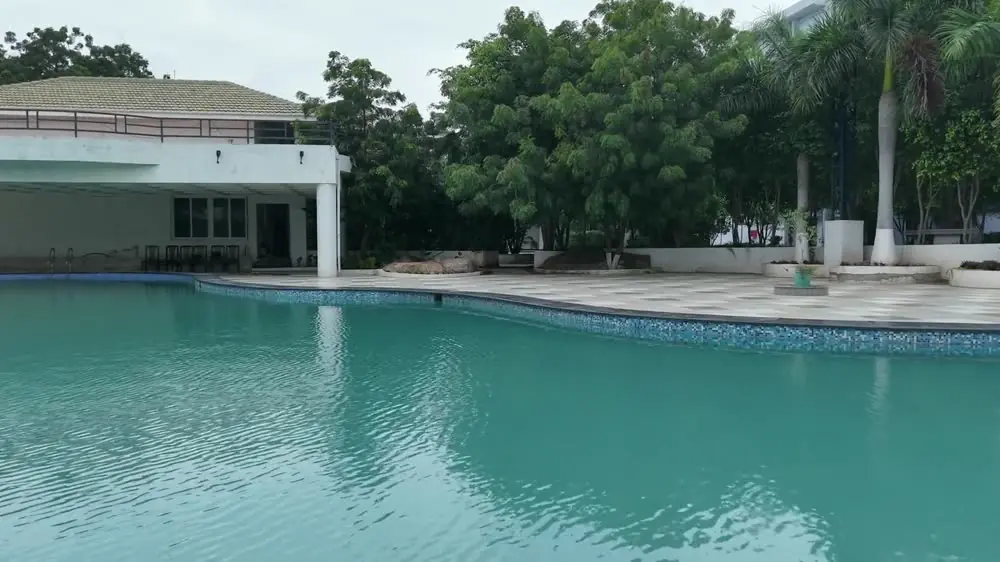 The outdoor pool and its pavilion by day