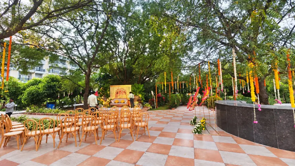Garden ceremony with a marigold mandap